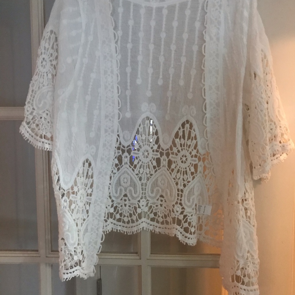 White crocheted jacket or sleeved vest